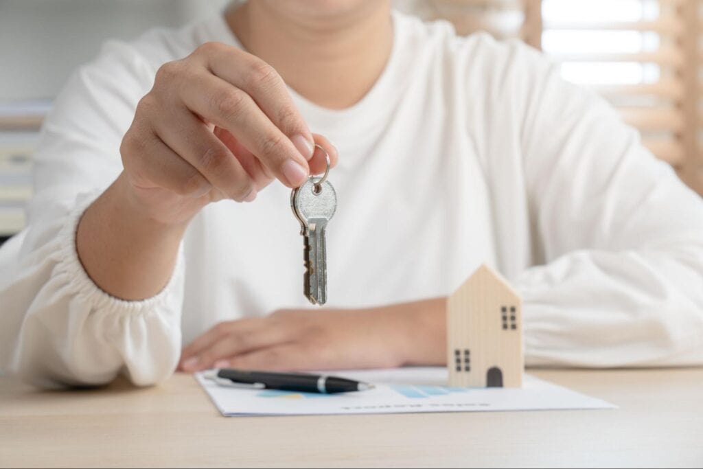 person holding house keys